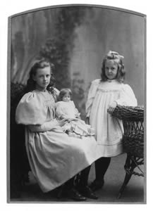 sisters with doll