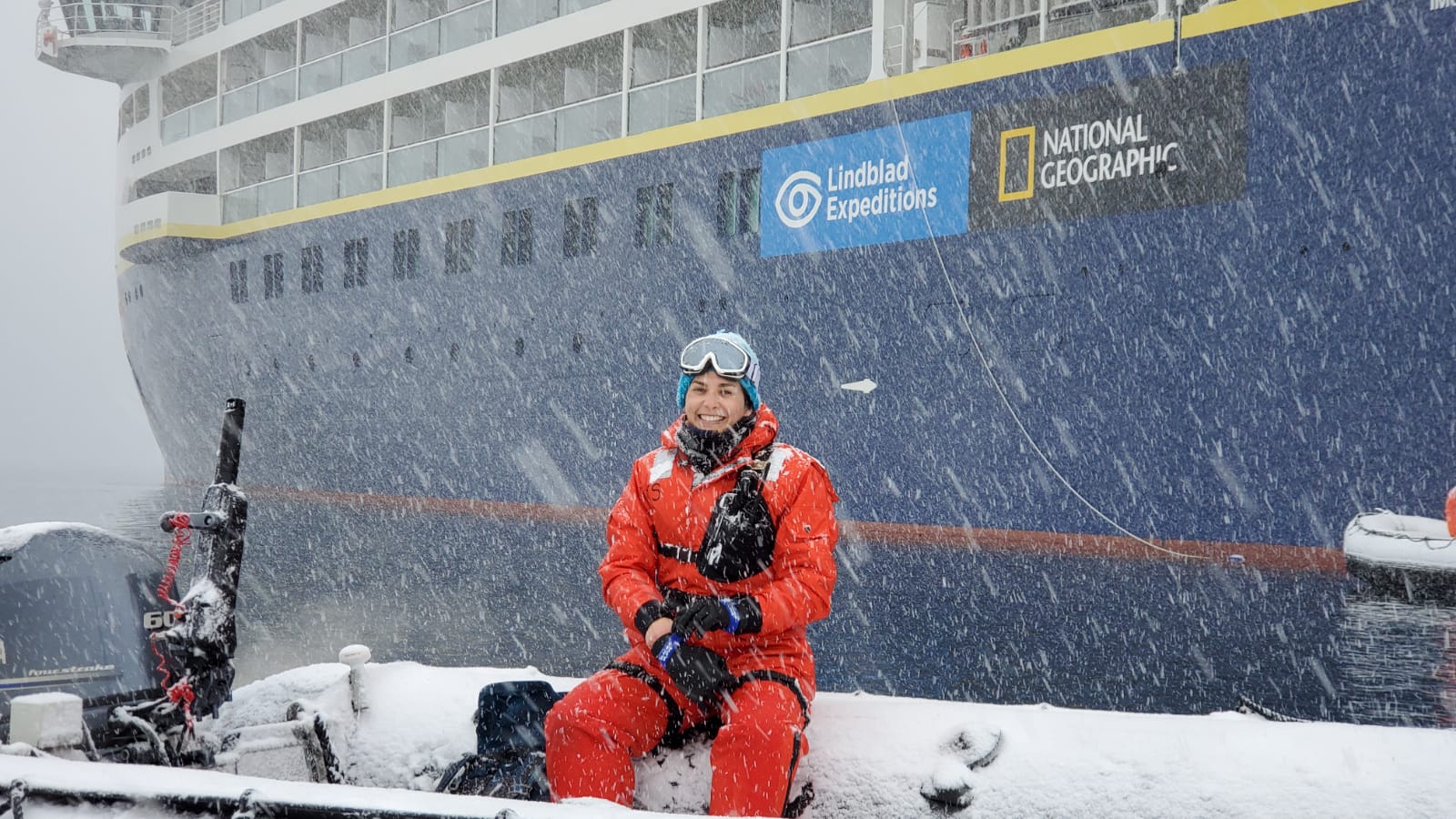 Maya Santangelo in front of Lindblad Expeditions vessel in Antarctica