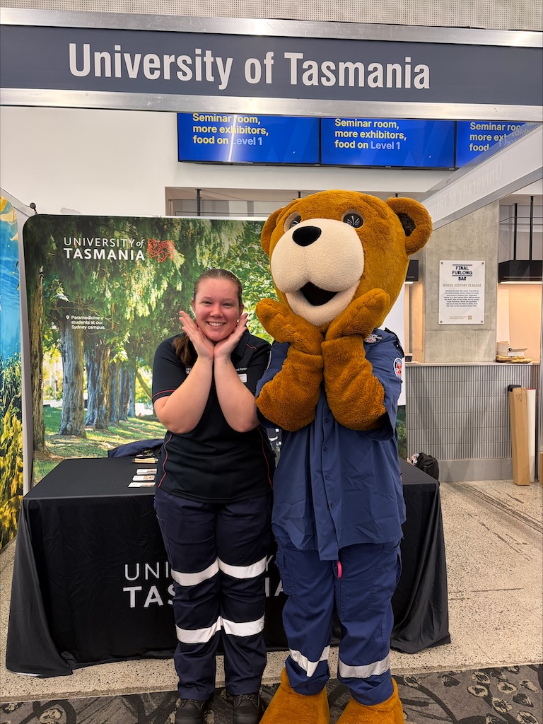 Caitlin posing with mascot