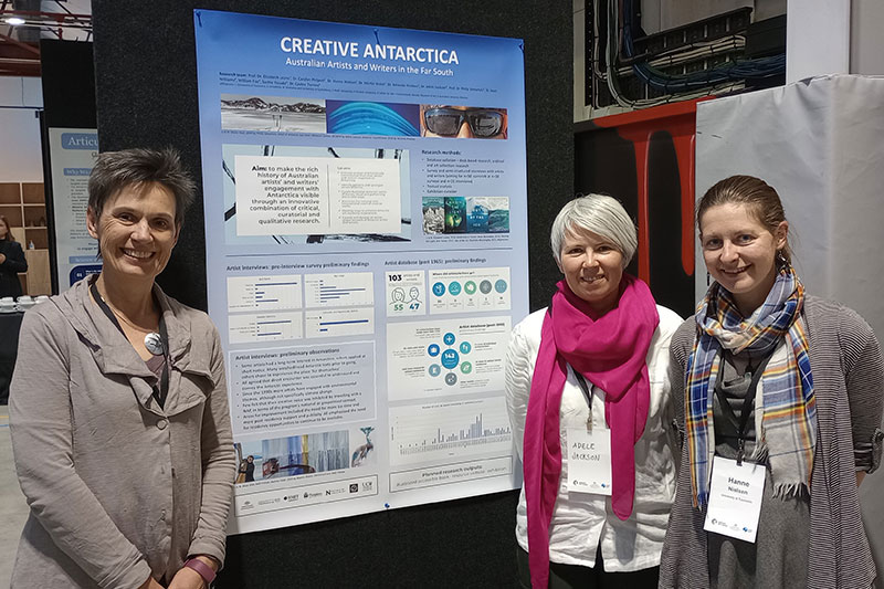 Professor Elizabeth Leane, Dr Adele Jackson, and Dr Hanne Nielsen with the Creative Antarctica NZAASC poster.