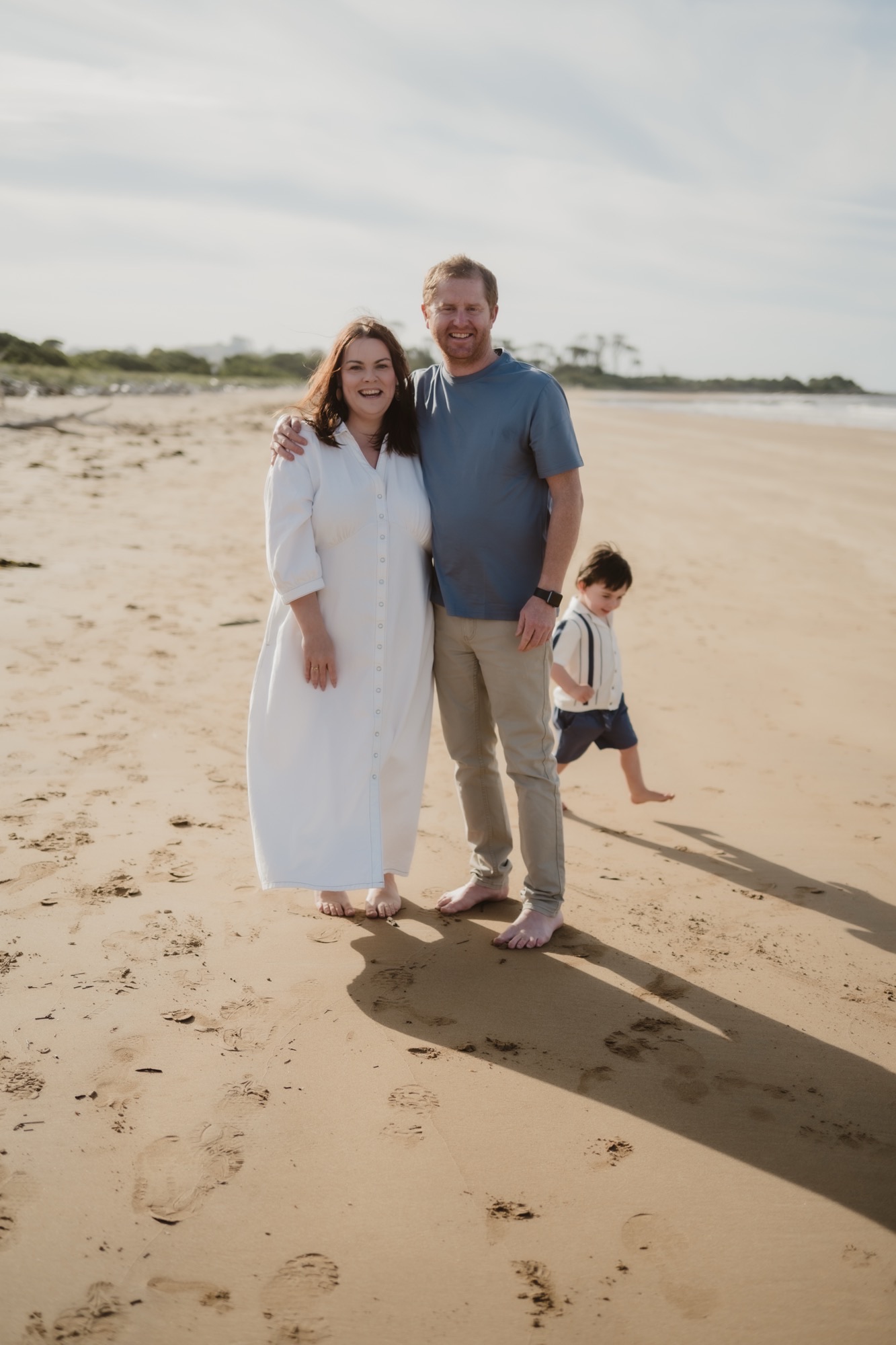 Evan Kemp with Lara Hay and son on a beach