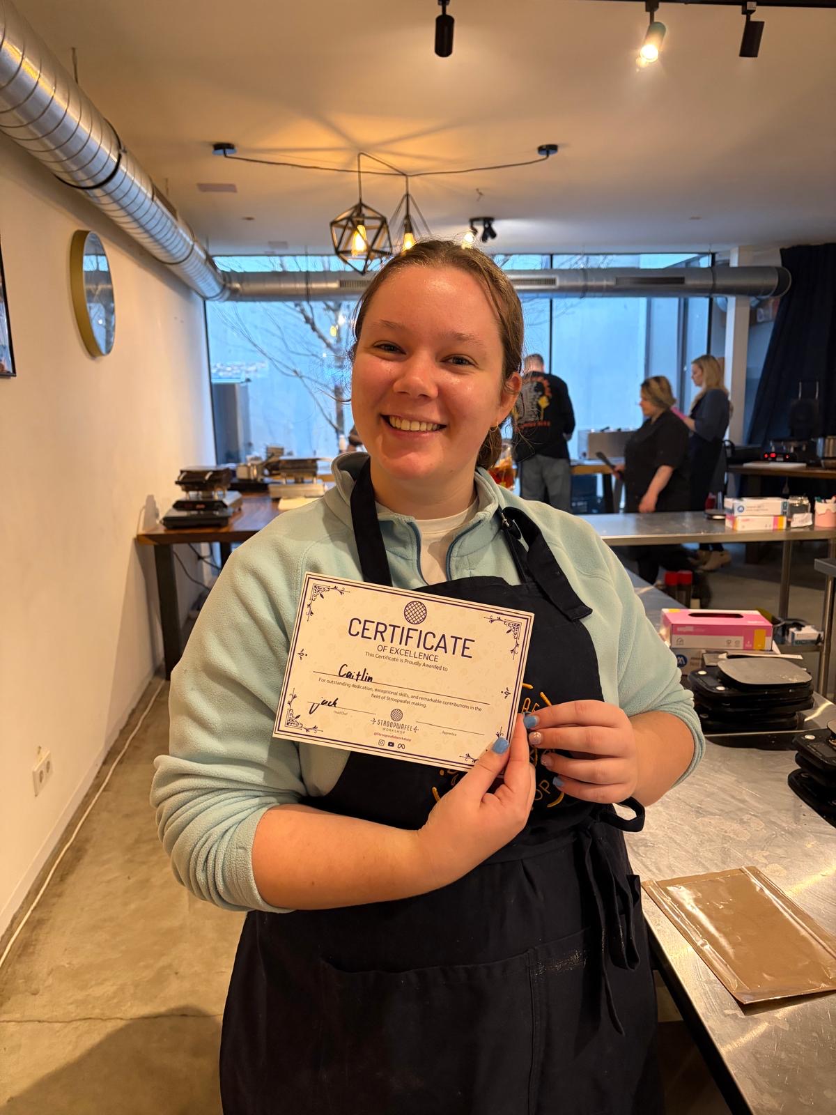 Caitlin with a Stroopwafel certificate