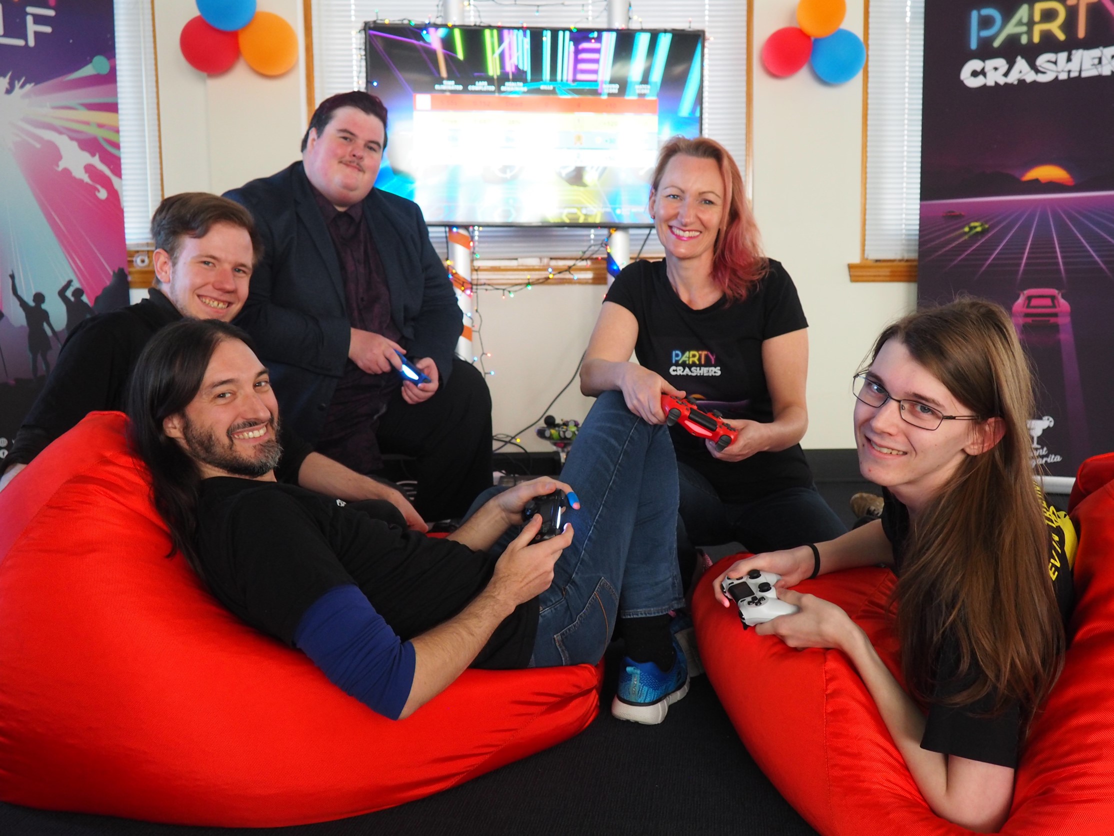 Members of the UTASPlay Group holding controllers playing Party Crashers