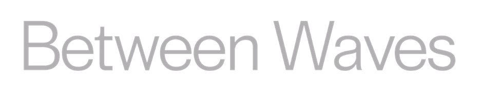 The images is the title of the exhibition BETWEEN WAVES. The letters are written in a light grey font