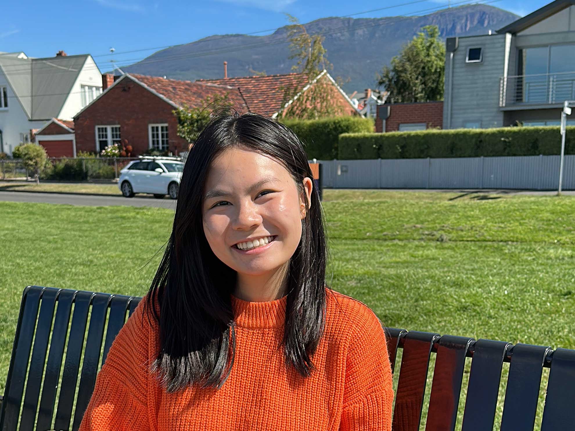 Vanni Pham sitting on a bench