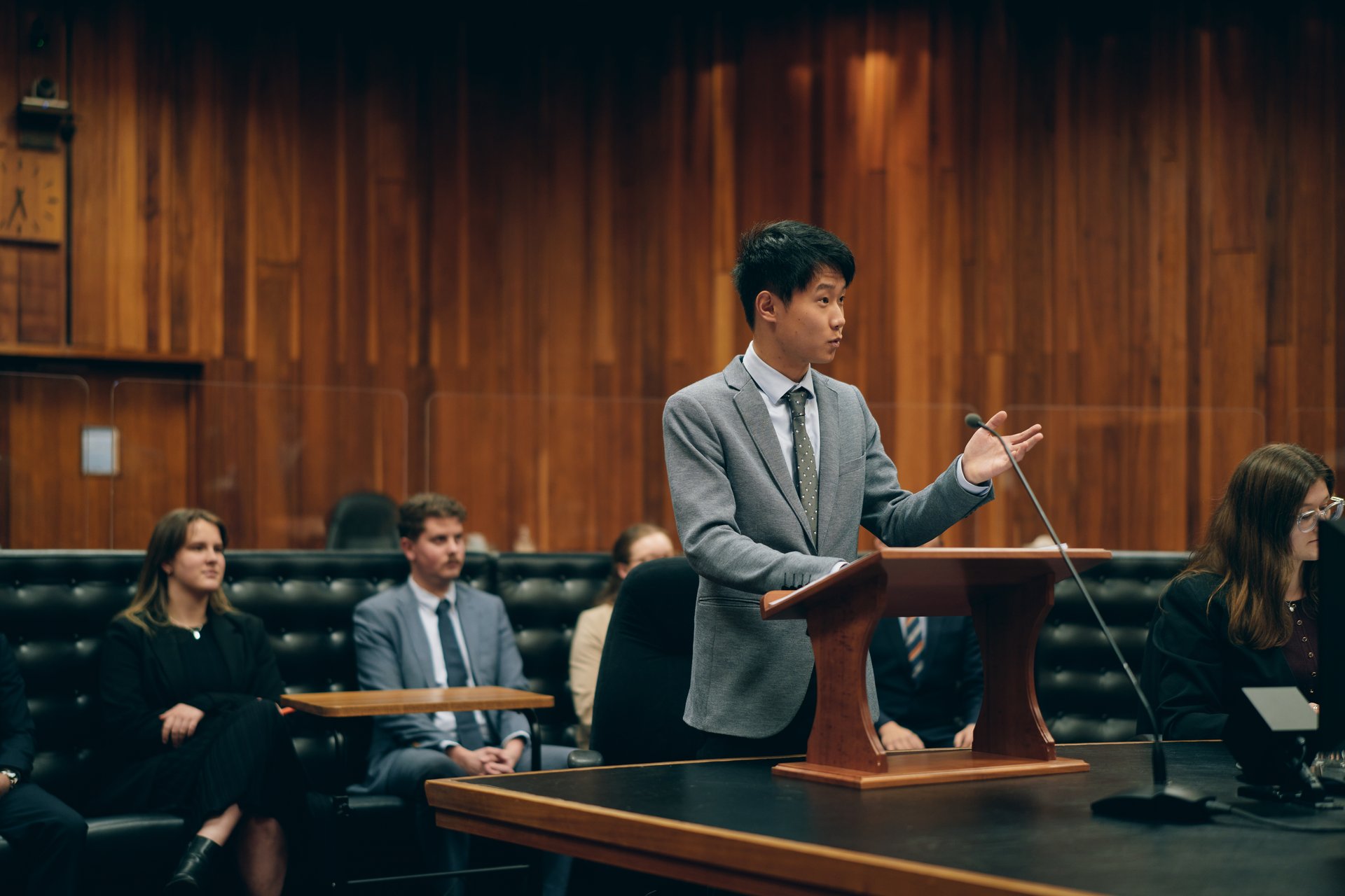 Man in a suit standing at a lectern in the Supreme Court of Tasmania
