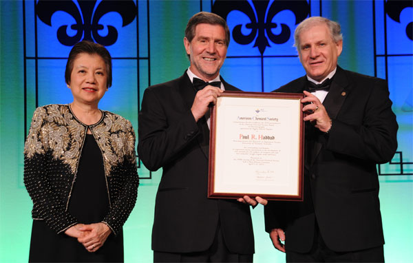 Marinda Wu and Prof Paul Haddad holding framed certificate with Dr Paul Ross