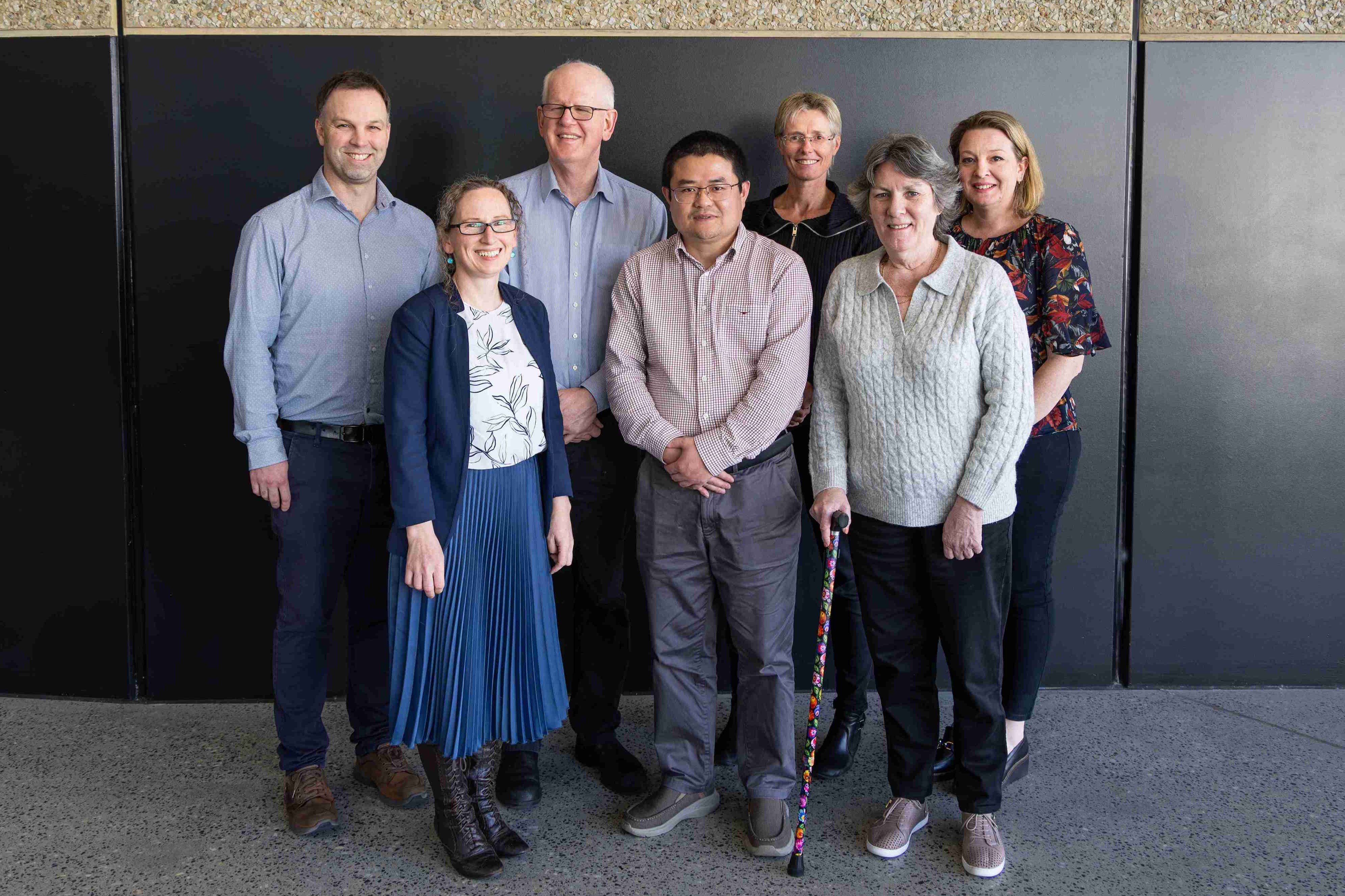 Group of smiling researchers at Menzies
