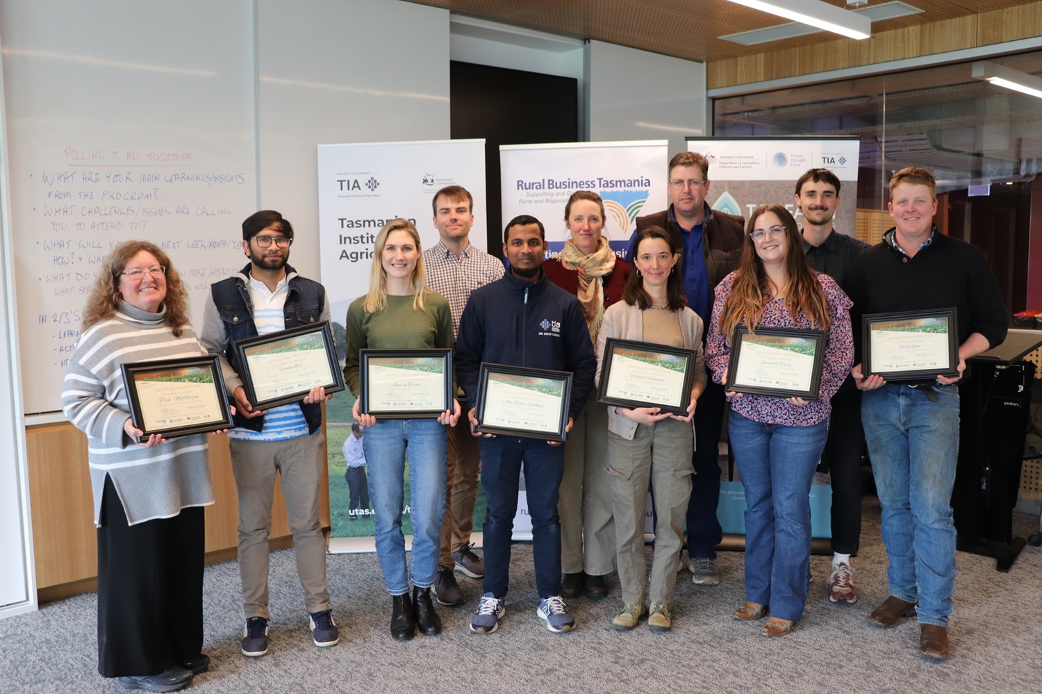 Enable Program graduation 2024 - group of students holding their certificates and smiling