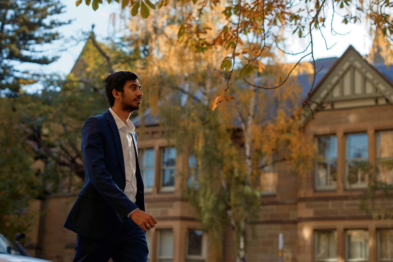 Ijaz walking in the street near Hobarts courts 