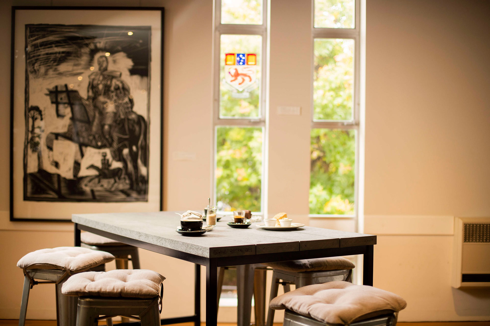University Club dining area with high table and seating.