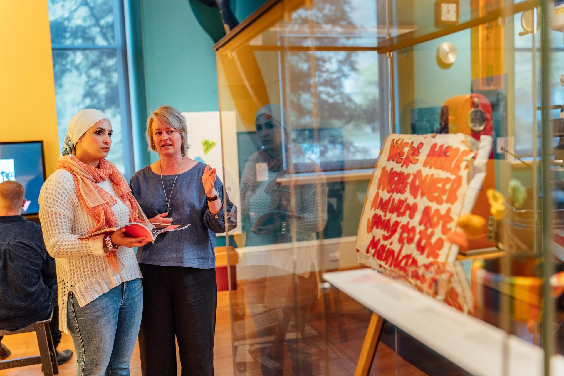 Lecturer and student at Tasmanian Museum and Art Gallery at the Power of Change exhibition