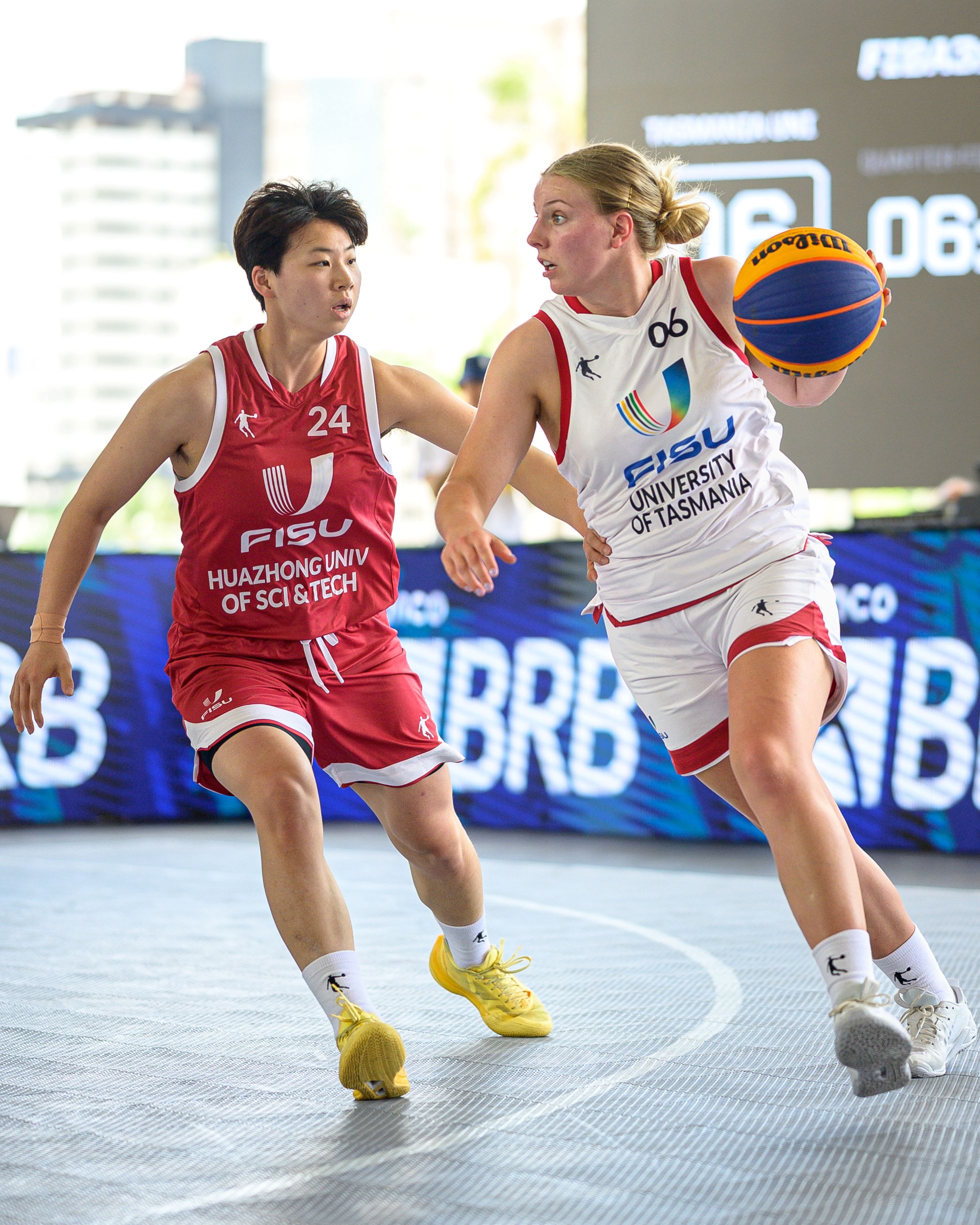 The University of Tasmania's Emerson Wells dodges a player from Huazhong University of Science and Technology during the quarterfinals of the 2025 FISU University World Cup 3×3 Basketball in Brazil.