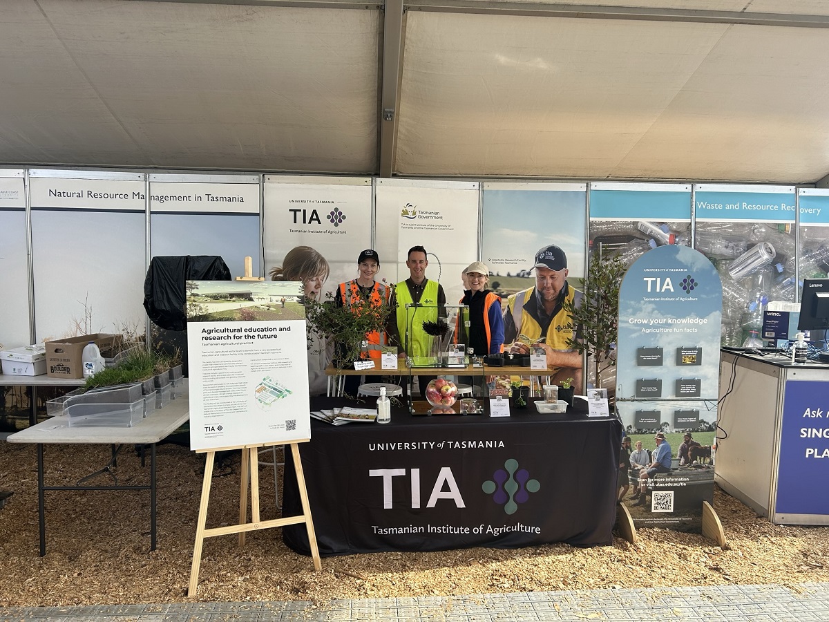 TIA team standing at the NRE Tas display 