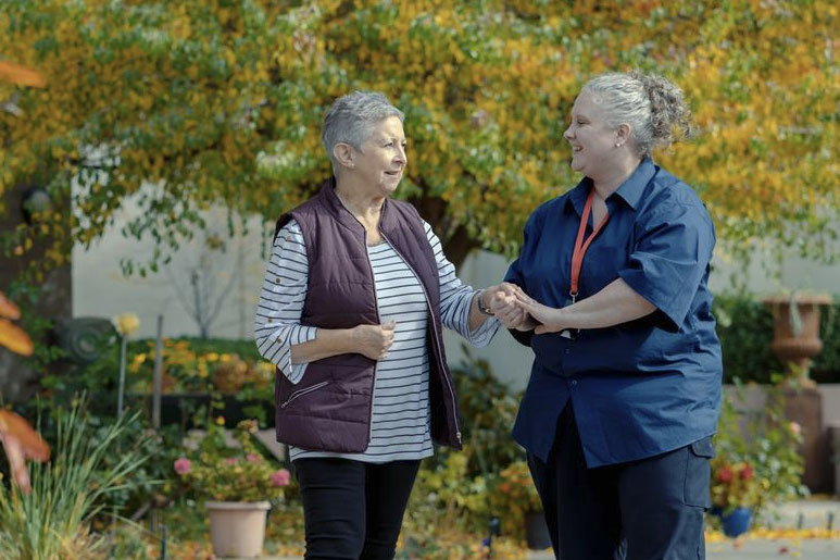 Dementia carer talking to patient 