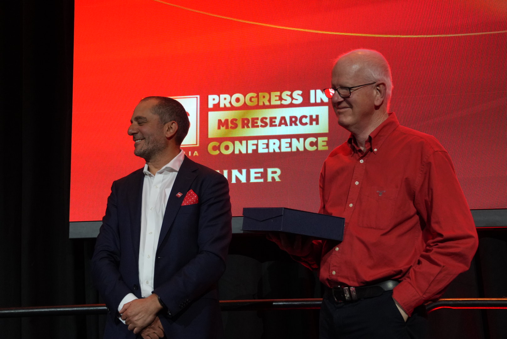 Two men standing on a stage