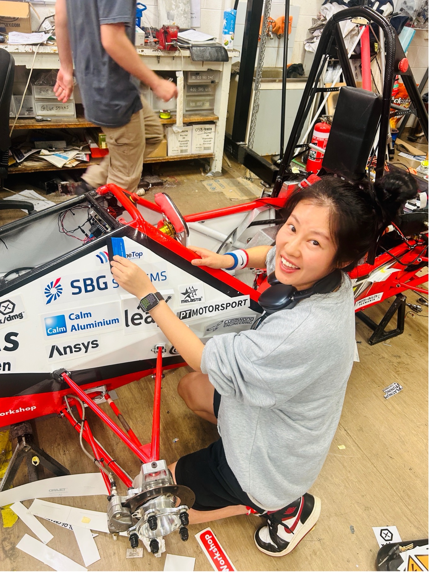 Student Luoyan Wei working on an autonomous vehicle