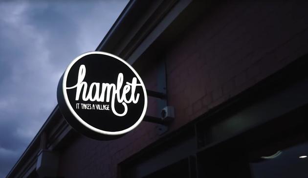 Hamlet Café sign, it takes a village sign