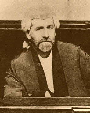 Clark as judge weaaring wig and gown 1898